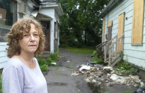 LifeSpin’s Jacqueline Thompson urges city politicians to hold property owners to proper standards of maintenance so buildings like these on Adelaide Street North don’t fall into disrepair and waste an opportunity to provide badly needed housing. (Mike Hensen/The London Free Press)