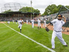 London Majors pitcher Pedro De Los Santos warms up in the outfield at Labatt Park before the team's first game of the Intercounty Baseball League season Friday. De Los Santos is getting the start for the Majors in their game Saturday in Welland against the Welland Jackfish. Photograph taken on Friday July 9, 2021. (Mike Hensen/The London Free Press)
