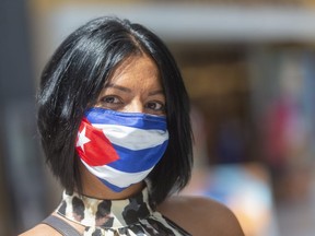 Cuban style: Teresa Naranjo, originally from Havana, wears her homeland's flag on her face mask during a recent visit to a London shopping mall. (Mike Hensen/The London Free Press)