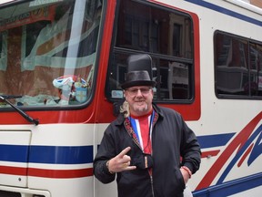 An England fan, who goes by the name Spoon, wears his team colours everywhere but on his sleeve as he pauses by his truck parked on Dundas Street near The Scot's Corner pub. "It's nail-biting," he said as the score remained deadlocked at one goal apiece for England and Italy. "It's going to penalties." (CALVI LEON/The London Free Press)