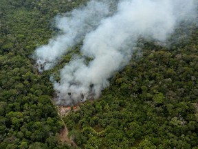 FILE PHOTO: An aerial view shows a fire in an area of the Amazon rainforest near Porto Velho, Rondonia State, Brazil, September 10, 2019. REUTERS/Bruno Kelly     TPX IMAGES OF THE DAY/File Photo ORG XMIT: FW1