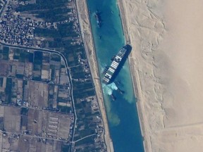 The container ship Ever Given, stuck in the Suez Canal in Egypt, is seen from the International Space Station. (NASA JSC ISS)