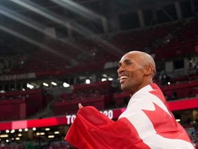 Damian Warner of London, Ont. celebrates after winning gold in mens decathlon.