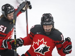 Canada's Ella Shelton, right, celebrates her goal with teammate Canada's Victoria Bach during second period IIHF Women's World Championship hockey action against Russia in Calgary, Alta., Sunday, Aug. 22, 2021. THE CANADIAN PRESS/Jeff McIntosh