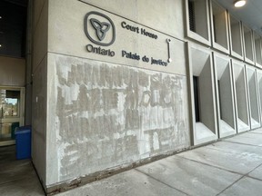 Graffiti painted on a wall at the London Courthouse on Queens Avenue had already been removed by early Wednesday morning.