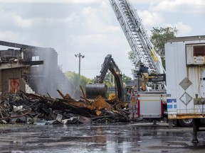 An abandoned building on Centre Street in London that was gutted by a fire Tuesday night was demolished on Wednesday. (Derek Ruttan/The London Free Press)