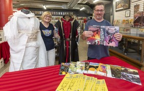 Carol Vandenberg and Gord Mood,  co-owners of L.A. Mood, get ready Wednesday, Aug. 11, 2021, for free comic book day Saturday in London. They will have cosplay outfits for photos as well as free comics to get new readers interested. (Mike Hensen/The London Free Press)