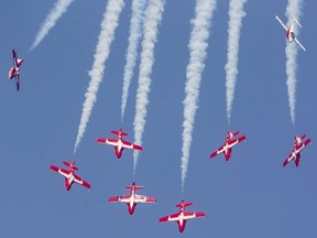 The Snowbirds speed downward during practice Thursday afternoon for this weekend's London airshow. Photo taken Thursday Aug. 26, 2021.  (Mike Hensen/The London Free Press)