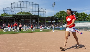 Golden Olympic swimmer Maggie Mac Neil strides to the stage during London's celebrations for its Summer Olympic stars, held in Labatt Park on Saturday August 28, 2021. Mike Hensen/The London Free Press/Postmedia Network