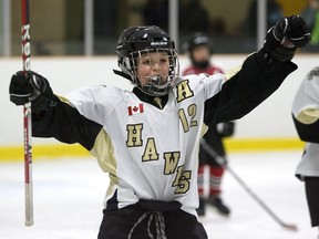 Cody Hale celebrates after teammate Ben Vreugdenhil scored to  give the West London Hawks a 3-0 lead over the Oakridge Aeros  at Stronach Arena in this LFP Archives photo from Friday, January 6, 2012. DEREK RUTTAN/The London Free Press