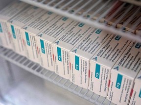 In this file photo taken on April 14, 2021 Packets of the AstraZeneca/Oxford Covid-19 vaccine, destined for housebound patients, are pictured in the fridge at Stubley Medical Centre near Chesterfield, central England on April 14, 2021.