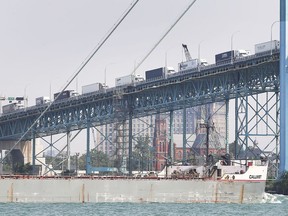 Trucks heading into Canada at the Ambassador Bridge in Windsor are backed up the length of the bridge on Friday as Canada Border Services Agency employees work to rule in support of their union in contract negotiations.
(DAN JANISSE/Postmedia Network)