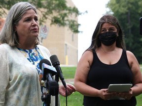 Sacha Coutu, right, looks on as Ontario NDP leader Andrea Horwath speaks in Wildwood Park in Bright's Grove Tuesday. Both were calling for reduced class sizes in Ontario to help guard against COVID-19 spread in schools. (Tyler Kula/The Observer)