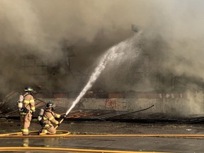 London firefighters battle a large fire at an abandoned building on Centre Street, north of Wharncliffe and Base Line roads, on Tuesday night. (DALE CARRUTHERS, The London Free Press)