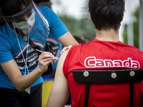 A person receiving a dose of Moderna at Dr. Nili Kaplan-Myrth's third Jabapalooza held on the field at Immaculata High School, Saturday, June 5, 2021.