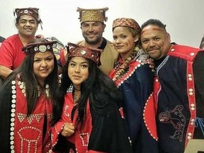 Adopted as a baby by a Woodstock family,  Natasha Pittman, front left, meets her birth mother's kin in Alert Bay, British Columbia, including Rolando Johnson, left,  Rosita Johnson, brother Allan Johnson, sister Natasha Galloway and  Rory Collis. (Supplied photo)