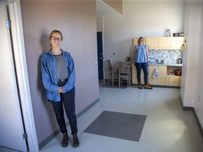 Natasha Thuemler (rear) is regional manager of Indwell and Jessica Mostert-Thiessen is program manager of Indwell's Railway City Lofts in St. Thomas. They are inside one of the affordable housing apartments provided by the Railway City Lofts program.  (Derek Ruttan/The London Free Press)