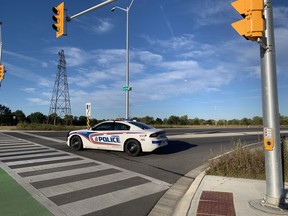 A London police cruisers blocks traffic at the corner of Clarke Road and Veterans Memorial Parkway following two early Tuesday collisions that sent one person to hospital. Photo taken Sept. 28, 2021. JONATHAN JUHA/The London Free Press