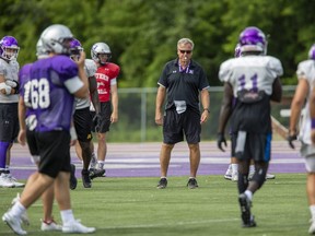 Head coach Greg Marshall puts players through their paces during Western Mustang football practice at TD Stadium in London. The Mustangs head to Guelph Saturday to play the Gryphons at 6 p.m.  (Derek Ruttan/The London Free Press file photo)