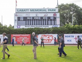 Several people enjoy a tour of Labatt Park in London on July 22. The oldest continuously used 
baseball grounds in the world is a new inductee into the London Sports Hall of Fame. (Derek Ruttan/The London Free Press)