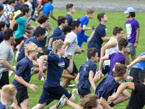 CCH students sprint at a practice Tuesday at the London high school. Students at London-area high schools must be fully vaccinated against COVID-19 to play on sports teams. Schools were given the green light last week to start practices. (Derek Ruttan/The London Free Press)