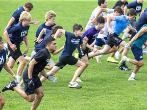 CCH Crusader football players sprint during practice after school in London. (Derek Ruttan/The London Free Press)