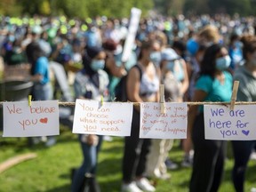 Attendees of a rally against sexual violence on campus at Western University were invited to write love letters to survivors that were displayed on a string. (Derek Ruttan/The London Free Press)
