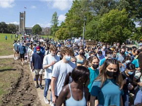 Thousands of people march Sept. 17, 2021, at Western University to protest sexual violence on campus following allegations of widespread drugging and sexual assaults involving female students at a residence during Orientation Week. (Derek Ruttan/The London Free Press)