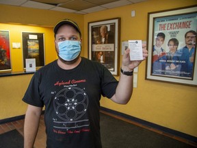 Hyland Cinema employee Mike Klassen had his vaccination receipt laminated for ease of use. Like many businesses in the province, the movie theatre will require proof of vaccination before allowing customers to enter the building. (Derek Ruttan/The London Free Press)