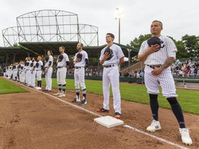 The London Majors line up for the national anthem in Labatt Park before taking on the Toronto Maple Leafs in their first game of the Intercounty Baseball League season July 9, 2021. The Majors will face the Maple Leafs in the league final that begins Friday at Labatt Park. (Mike Hensen/The London Free Press)