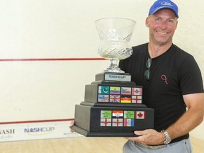Jay Nash holds the Nash Cup in London. The squash tournament will have a full slate of professional players, representing 15 countries. (Mike Hensen/The London Free Press)