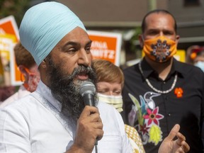 Federal NDP Leader Jagmeet Singh speaks at a rally Wednesday in London as Shawna Lewkowitz, the party's candidate in London West, looks on. Singh criticized the Liberals for their "broken commitments" on pharmacare and housing and said an NDP government would make significant investments in health care.  (Mike Hensen/The London Free Press)