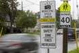 Signs in front of Princess Elizabeth public school on Thompson Road in London warn drivers that photo radar is on the way. The first two cameras in the city's new system are being set up at Princess Elizabeth and on Second Street near F.D. Roosevelt elementary school. The city's goal is to reduce speeds in school zones, where the speed limit is 40 km/h.  (Mike Hensen/The London Free Press)