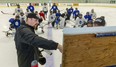 London Nationals head coach Colin Martin and assistant coach Jeff Bradley instruct players at a practice Sept. 23, 2021, at the Western Fair Sports Centre. (Mike Hensen/The London Free Press)