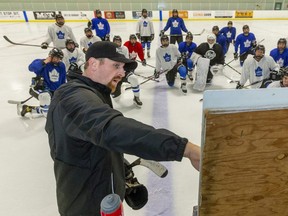 New London Nationals head coach Colin Martin and assistant coach Jeff Bradley instruct players at a practice Thursday at the Western Fair Sports Centre. (Mike Hensen/The London Free Press)