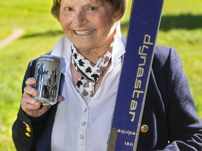 Betty Chapman shows off Anderson Ales' new Boler Brew packaging celebrating the Byron ski club's 75th anniversary. The can features a 1964 London Free Press image, pulled from Western University archives, showing Chapman and other club champions. (Mike Hensen/The London Free Press)