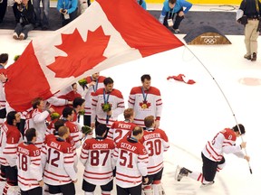 London native Drew Doughty skates off with the Canadian flag as the men's national team celebrates a legendary gold-medal win over the U.S. at the Vancouver Olympics on Feb. 28, 2010. Canada won 3-2 on an overtime goal by Sidney Crosby. (URI KADOBNOV/AFP/Getty Images)
