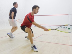 Lyell Fuller returns a shot against Elliot Selby in this September 2015 file photo at the Nash Cup at London Squash and Fitness Club. (Derek Ruttan/The London Free Press)