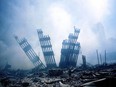 The aftermath: 'An immense heap of pulverized steel and concrete was silhouetted by searchlights, and disgorging smoke, asbestos, ash and hate.'