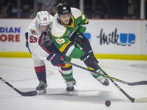 Windsor's Wyatt Johnston battles London's Gerard Keane for the puck during OHL action between the Windsor Spitfires and the London Knights at the WFCU Centre, on Monday, Oct. 11, 2021.  (DAX MELMER/Postmedia Network)