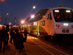 A crowd of onlookers at the Stratford train station welcomes the GO train from Toronto shortly before 7 p.m. Monday on the inaugural day of the rail service’s Southwestern Ontario line. (Galen Simmons/Postmedia Network)