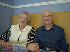 Former teen sweethearts Ross Dilling, 94, and Orene McNaughton, 90, rekindle their friendship at the Early Riser Cafe, where they bumped into each other last month. (Calvi Leon/The London Free Press)