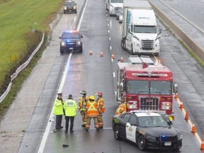 One person is dead, and another suffered life-threatening injuries, after a crash involving a transport truck on Highway 401 at Colonel Talbot Road Sunday morning. Derek Ruttan/The London Free Press)