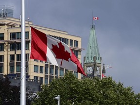 Canada flags continue to fly at half-mast in Ottawa on Monday, June 28, 2021. (THE CANADIAN PRESS/Sean Kilpatrick)