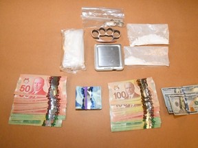 A London man, 36, faces charges after police seized drugs, cash and other items during the search of a home and vehicle over the weekend, police said. (London police supplied photo)