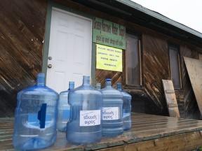 Water bottles are seen at the local water supply site on the Grassy Narrows First Nation, in northwestern Ontario, Saturday, Oct. 5, 2019.