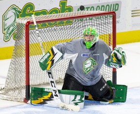 London Knights goalie Mathias Onuska follows a puck that ricocheted off the shaft of his stick during team practice at Budweiser Gardens. (Derek Ruttan/The London Free Press)