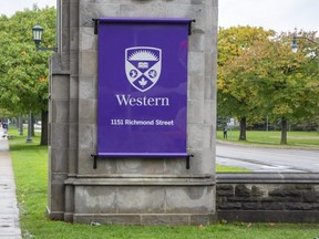 Western University main gates on Richmond Street at University Drive in London, Ont. on Thursday, Oct. 21, 2021. Police have charged a London man with criminal harassment after three women were followed near the Richmond Street and University Drive intersection. The same man also faces other harassment charges. (Derek Ruttan/The London Free Press)