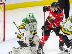 London Knights goalie Brett Brochu makes a save in front of Owen Sound Attack player Stepan Machacek during the first period of their game at Budweiser Gardens in London, Ont. on Friday October 22, 2021. Derek Ruttan/The London Free Press/Postmedia Network