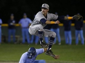 London Majors second baseman Chris McQueen turns a double play on Toronto Maple Leafs Justin Marra during Game 4 of the Intercounty Baseball championship at Christie Pits on Thursday in Toronto The Leafs went on to win 6-5 in extra innings. Jack Boland/Toronto Sun